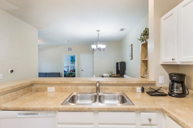 kitchen with white dishwasher, a notable chandelier, sink, white cabinetry, and decorative light fixtures