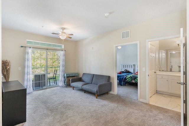 living room with ceiling fan and light carpet