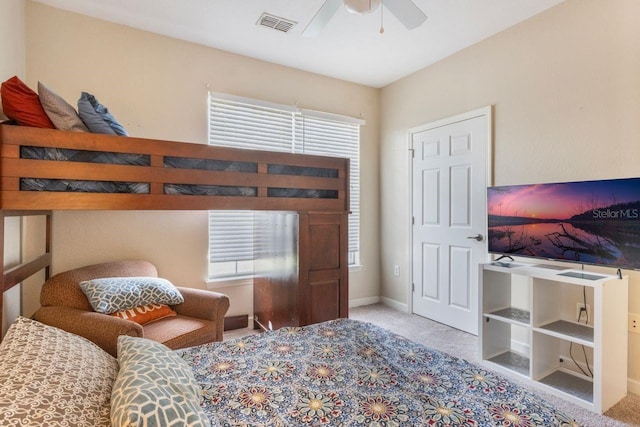 bedroom with light colored carpet and ceiling fan