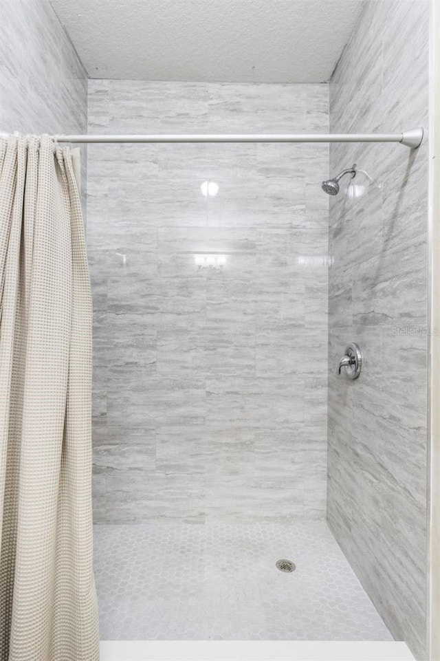 bathroom with a shower with curtain