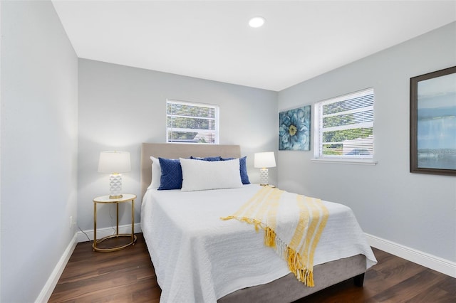 bedroom with recessed lighting, baseboards, and wood finished floors