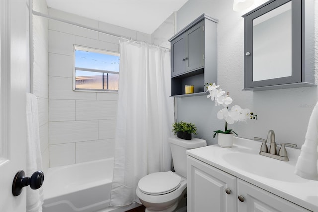 full bath with vanity, toilet, and shower / bath combo with shower curtain