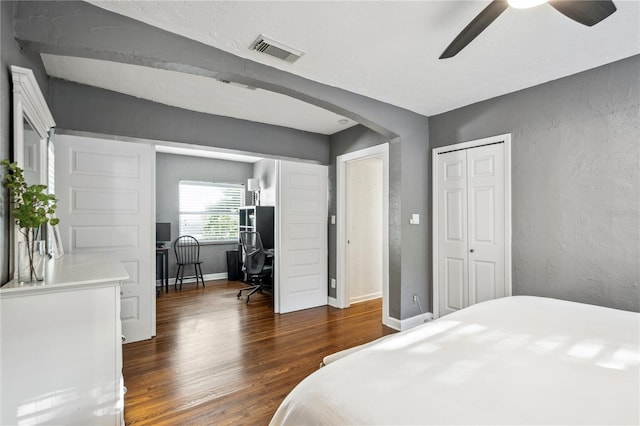 bedroom featuring ceiling fan and dark wood-type flooring