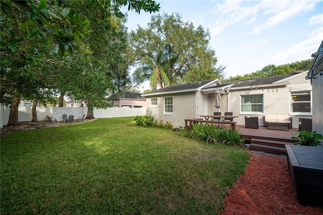 view of yard with a wooden deck