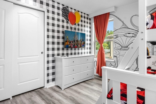 bedroom with light wood-type flooring