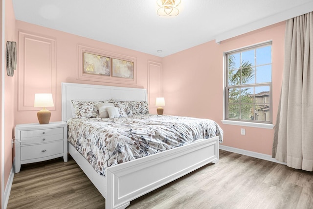 bedroom featuring wood-type flooring