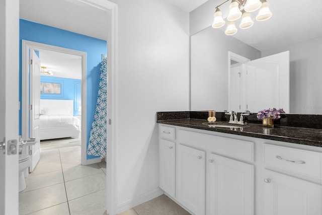 bathroom with tile patterned flooring and vanity