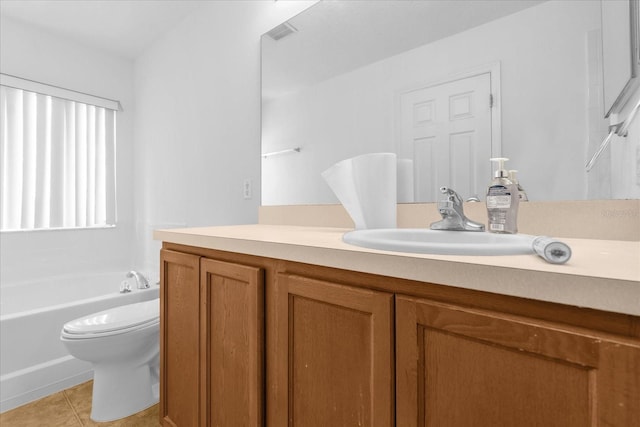 bathroom featuring vanity, toilet, a washtub, and tile patterned flooring