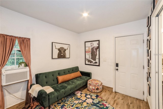 living room featuring light hardwood / wood-style flooring and cooling unit