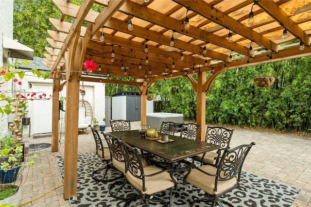 view of patio / terrace featuring a pergola, a hot tub, and a storage shed