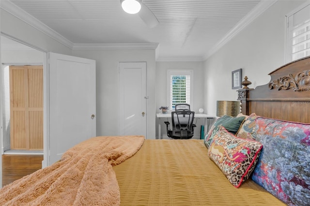 bedroom featuring ceiling fan and ornamental molding