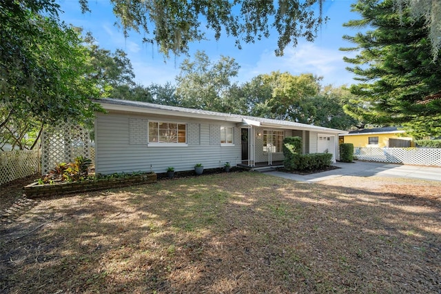 single story home featuring a garage