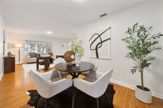 dining area with light hardwood / wood-style flooring