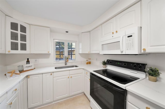 kitchen with white appliances and white cabinets