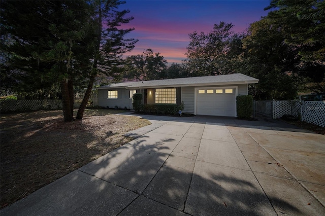 ranch-style home with a garage