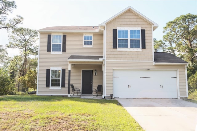 view of front of house featuring a garage and a front lawn