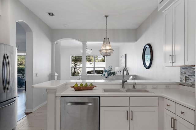 kitchen with sink, white cabinets, a wealth of natural light, and stainless steel appliances