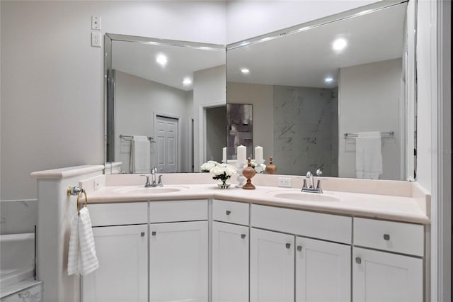 bathroom featuring vanity and a shower