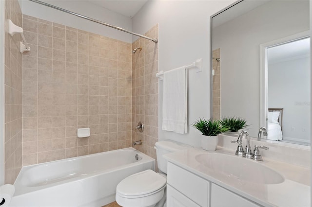 full bathroom with vanity, toilet, and tiled shower / bath