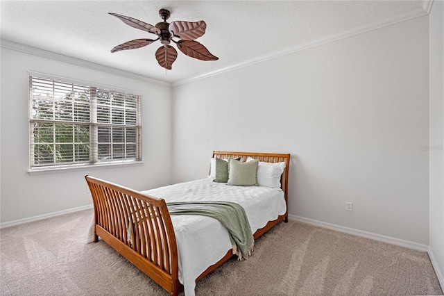 bedroom featuring ceiling fan, carpet flooring, and ornamental molding