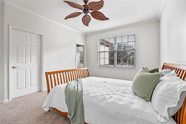 bedroom with ceiling fan, ornamental molding, and carpet floors