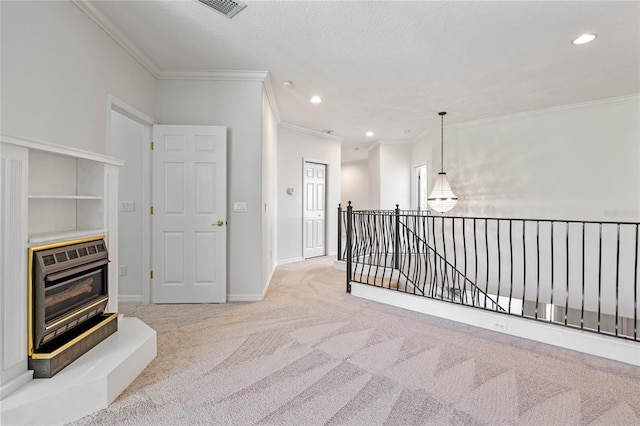 hallway featuring light colored carpet, a textured ceiling, heating unit, and crown molding