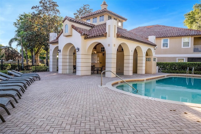 view of swimming pool featuring a patio area