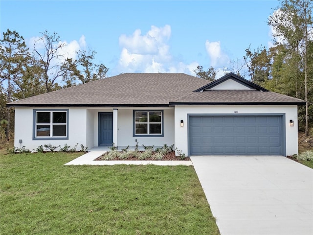 ranch-style house featuring a garage and a front lawn