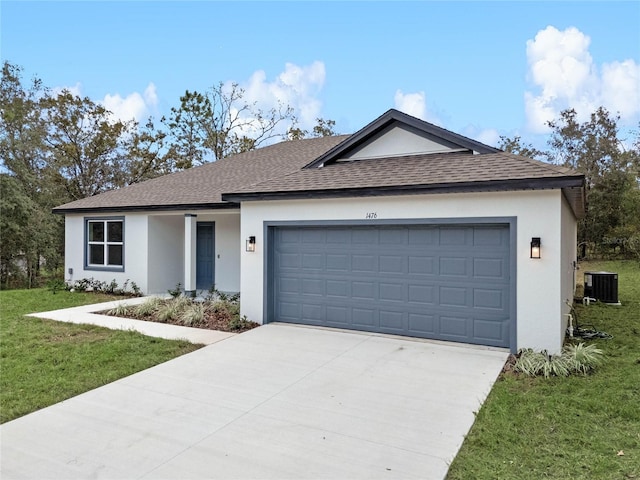 ranch-style home with a front lawn, central AC unit, and a garage