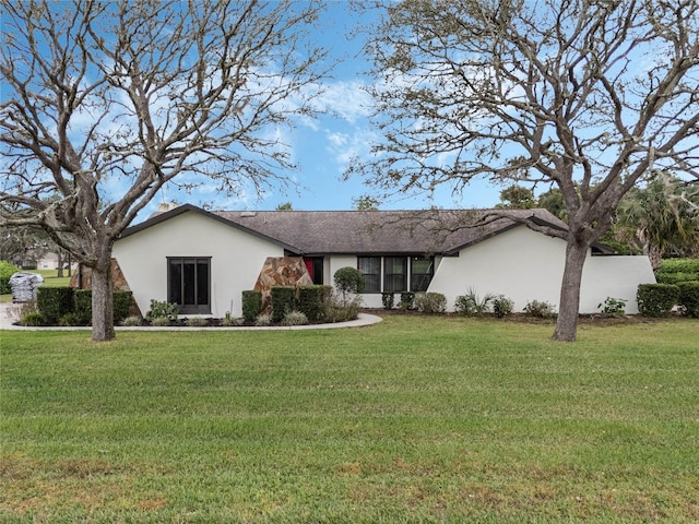 single story home with a front lawn