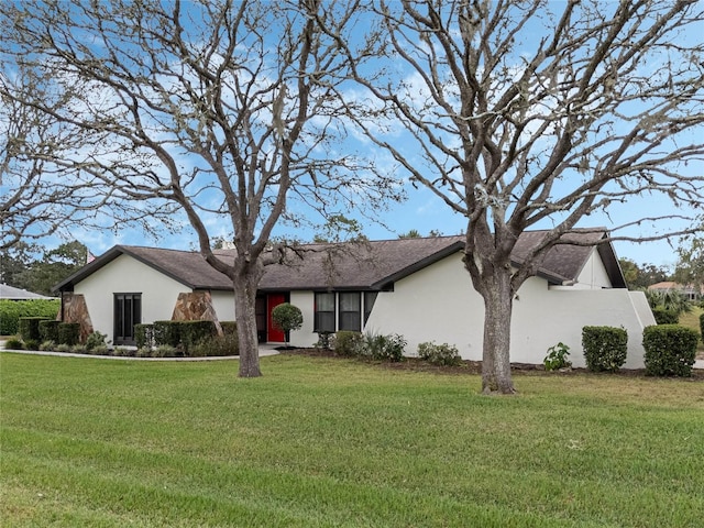 single story home with a front lawn