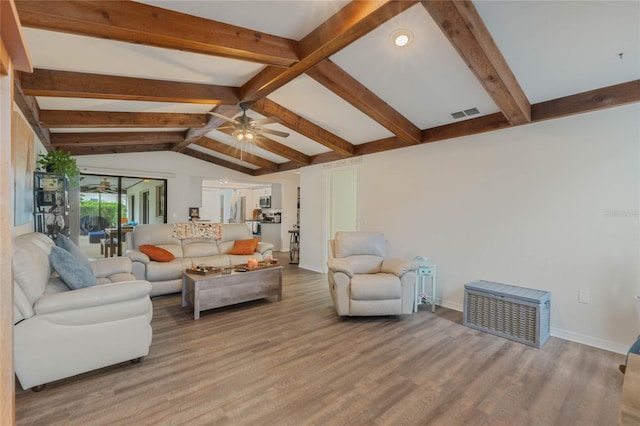 living room featuring wood-type flooring, vaulted ceiling with beams, and ceiling fan