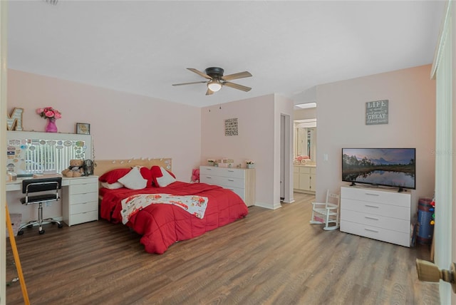 bedroom featuring ensuite bathroom, wood-type flooring, and ceiling fan