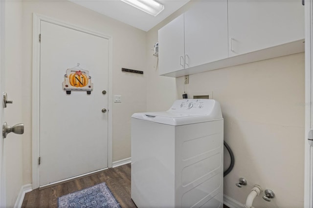 washroom with dark hardwood / wood-style flooring, cabinets, and washer / dryer