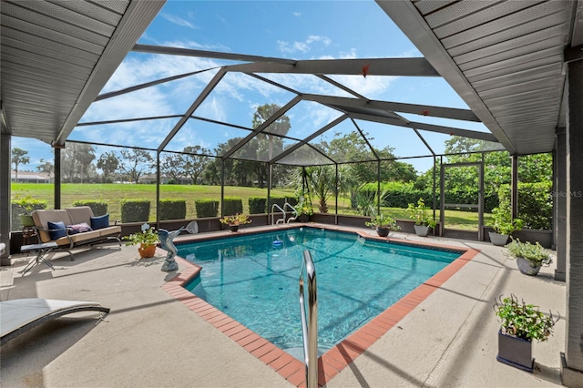 view of pool featuring glass enclosure, an outdoor living space, and a patio area