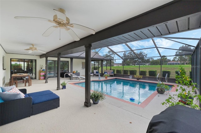 view of pool with grilling area, an outdoor living space, ceiling fan, a patio, and a lanai