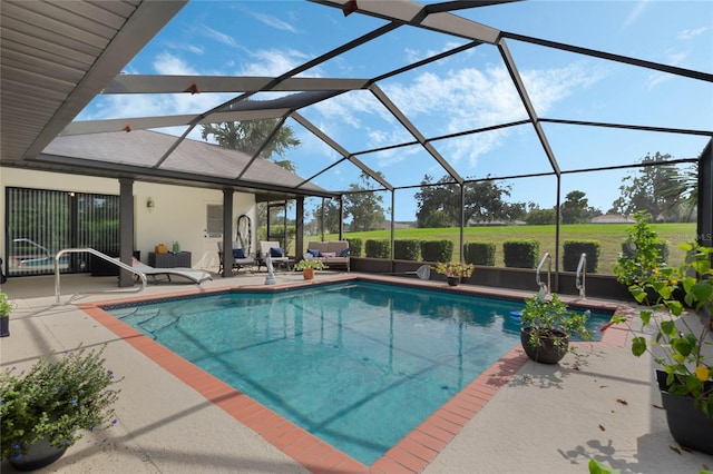 view of pool with an outdoor living space, glass enclosure, and a patio area