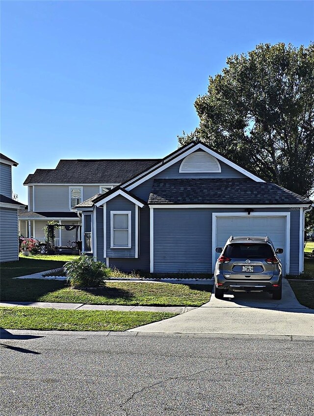 ranch-style house with a front lawn and a garage