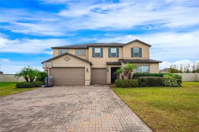 view of front facade featuring a front yard and a garage