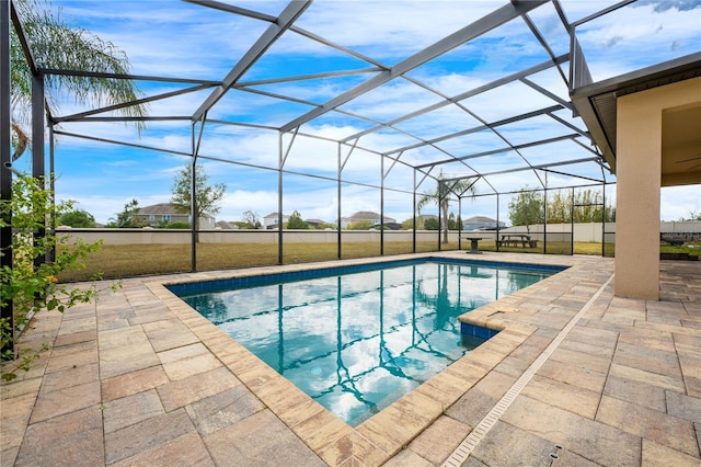 view of pool with a lanai and a patio area