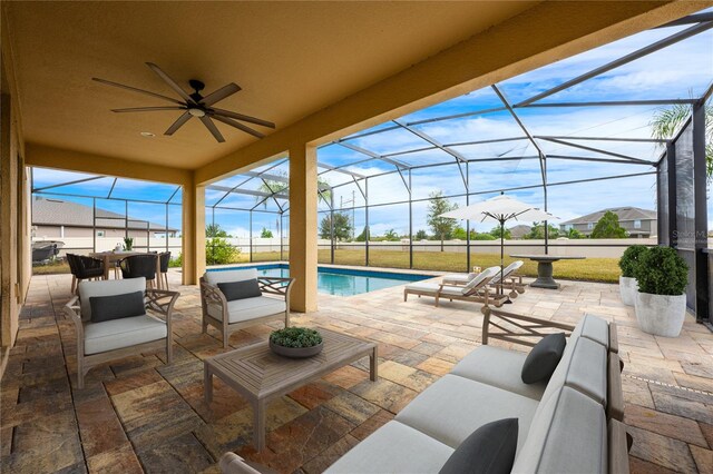 view of patio / terrace with outdoor lounge area, ceiling fan, and a lanai