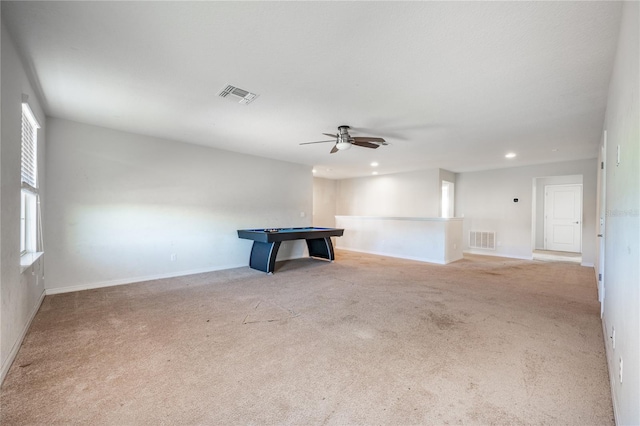 carpeted spare room with ceiling fan