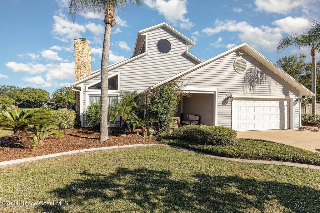 view of front property with a garage and a front yard