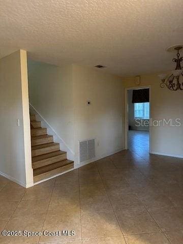 interior space with a textured ceiling