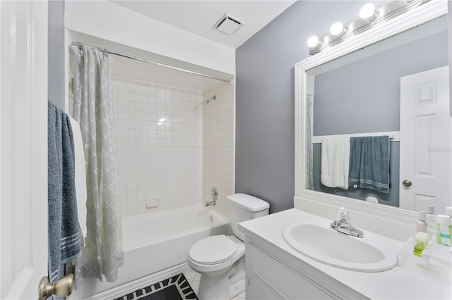 full bathroom with tile patterned flooring, vanity, toilet, and shower / tub combo