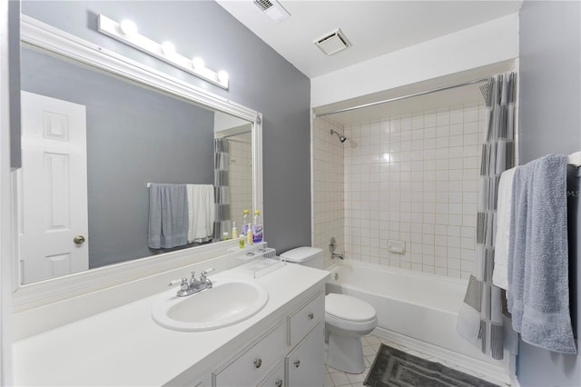 full bathroom featuring vanity, shower / bath combo with shower curtain, tile patterned flooring, and toilet