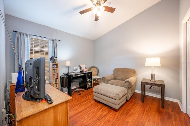 office space featuring ceiling fan, hardwood / wood-style floors, and lofted ceiling