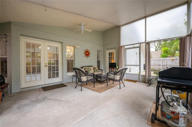 sunroom featuring french doors and ceiling fan