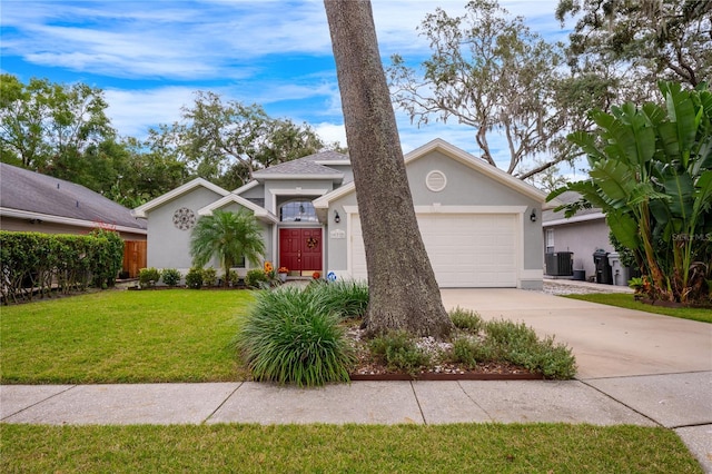 view of front of house featuring a garage and a front lawn