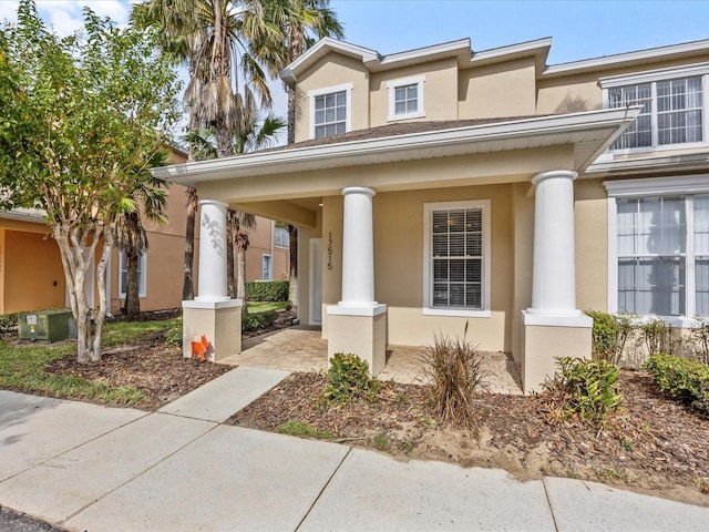 property entrance featuring covered porch